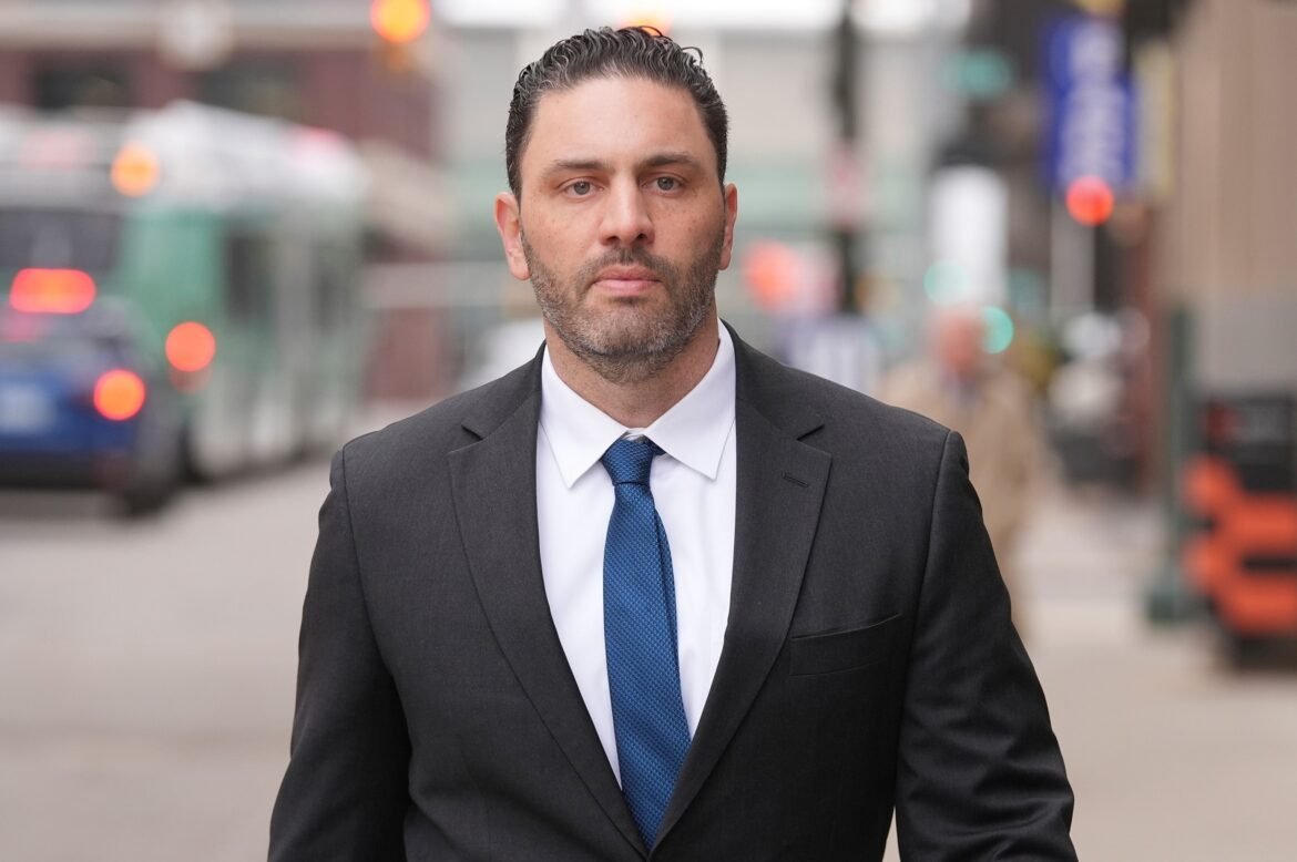 Former Michigan football coach asks judge to dismiss part of hacked images case

